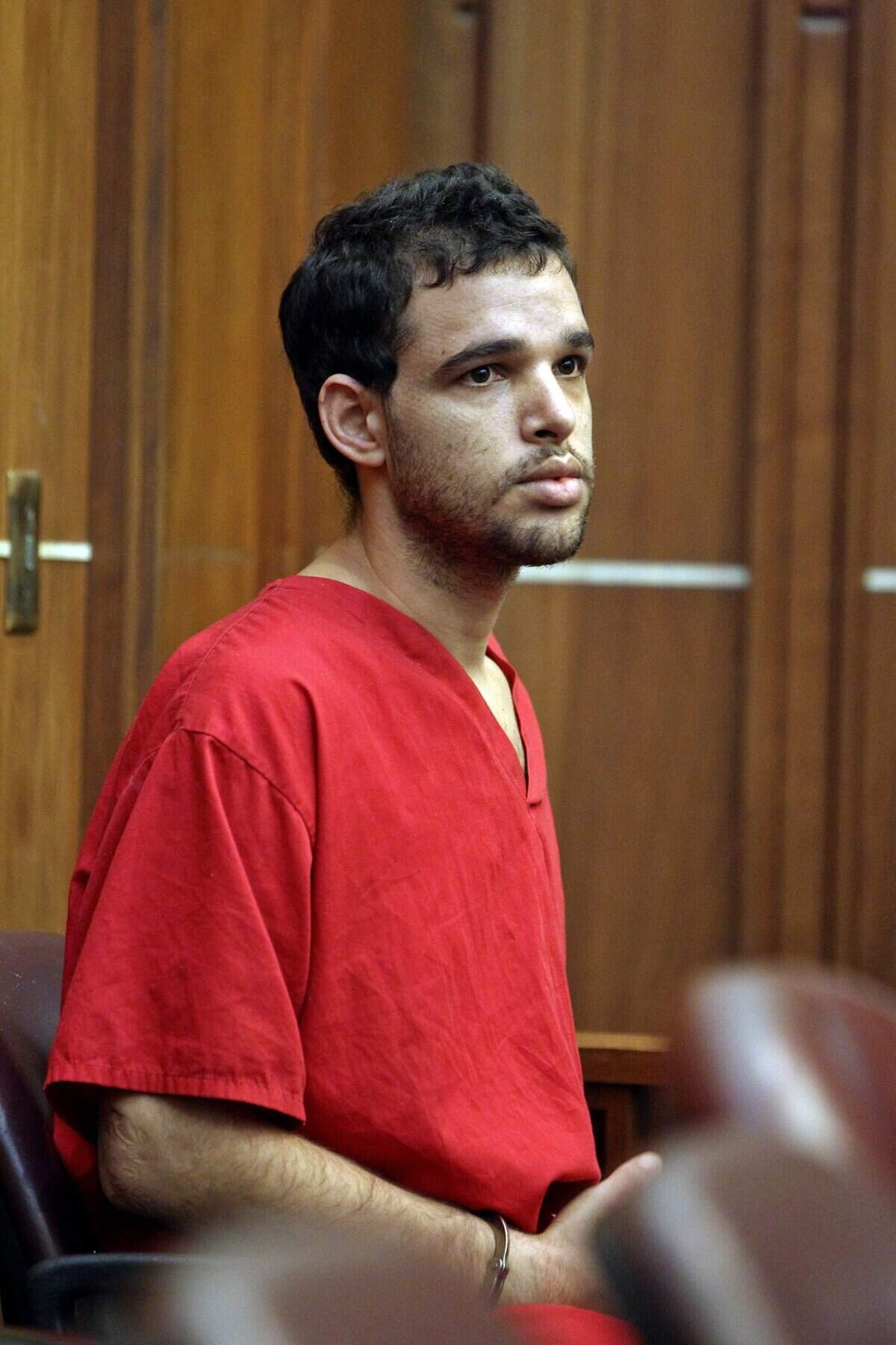 Alberto Sierra, accused of murdering his wife and her two young daughters, plus raping the woman and one of the girls appears in court on Thursday, Jan. 31, 2013.